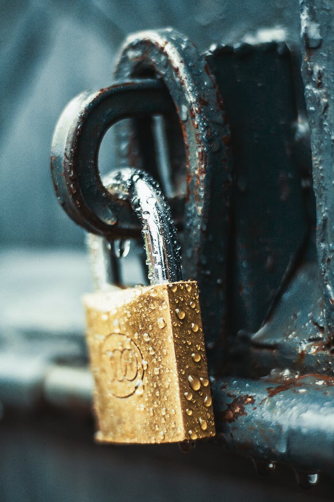 Close-Up Photography of Wet Padlock